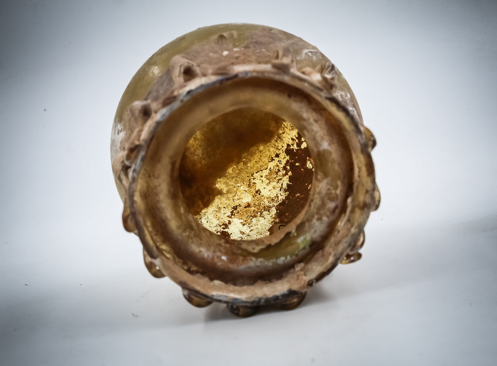 A Yellow Glass Jar With Dense Zigzag Thread Around The Neck