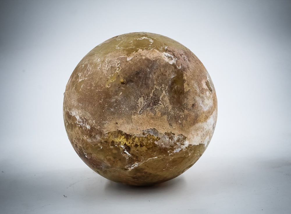 A Yellow Glass Jar With Dense Zigzag Thread Around The Neck