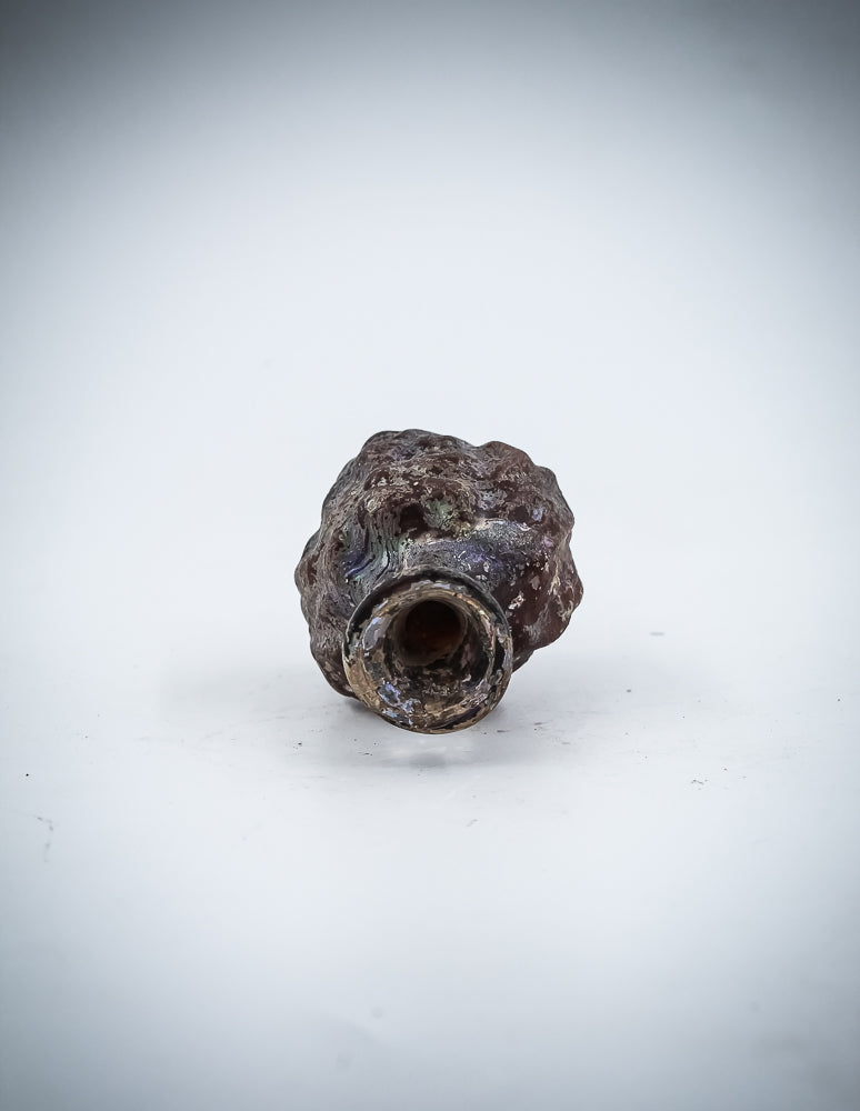 A Small  Glass Janus-Head Bottle