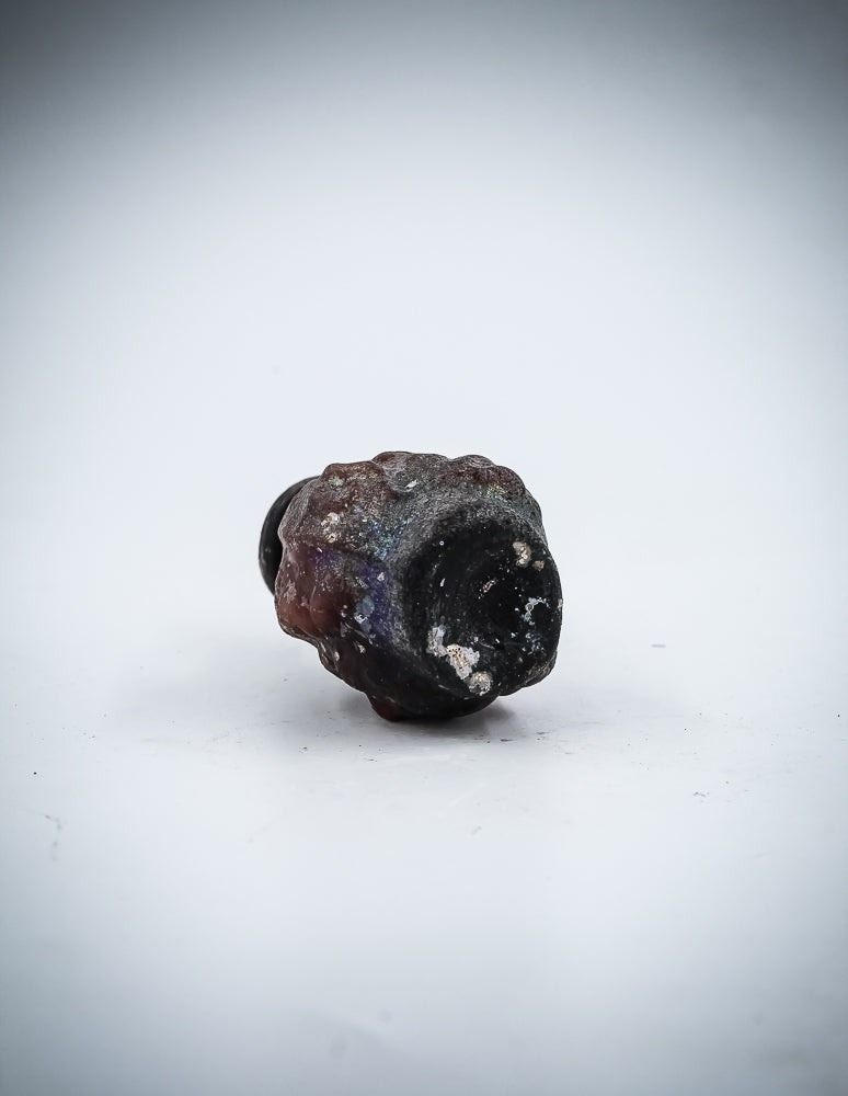 A Small  Glass Janus-Head Bottle