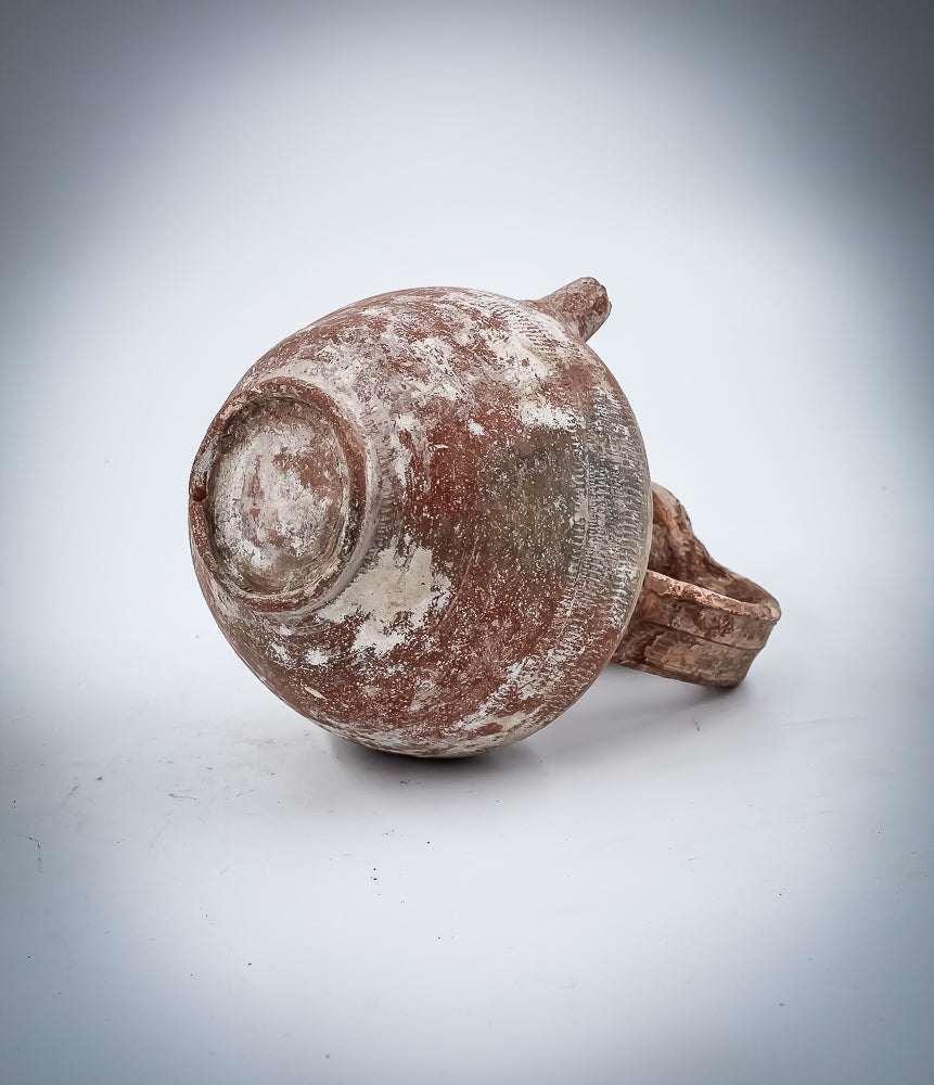 A Nabatean Terracotta Juglet With Saucer