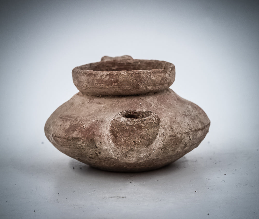A TERRACOTTA “SHABBAT” OIL LAMP
