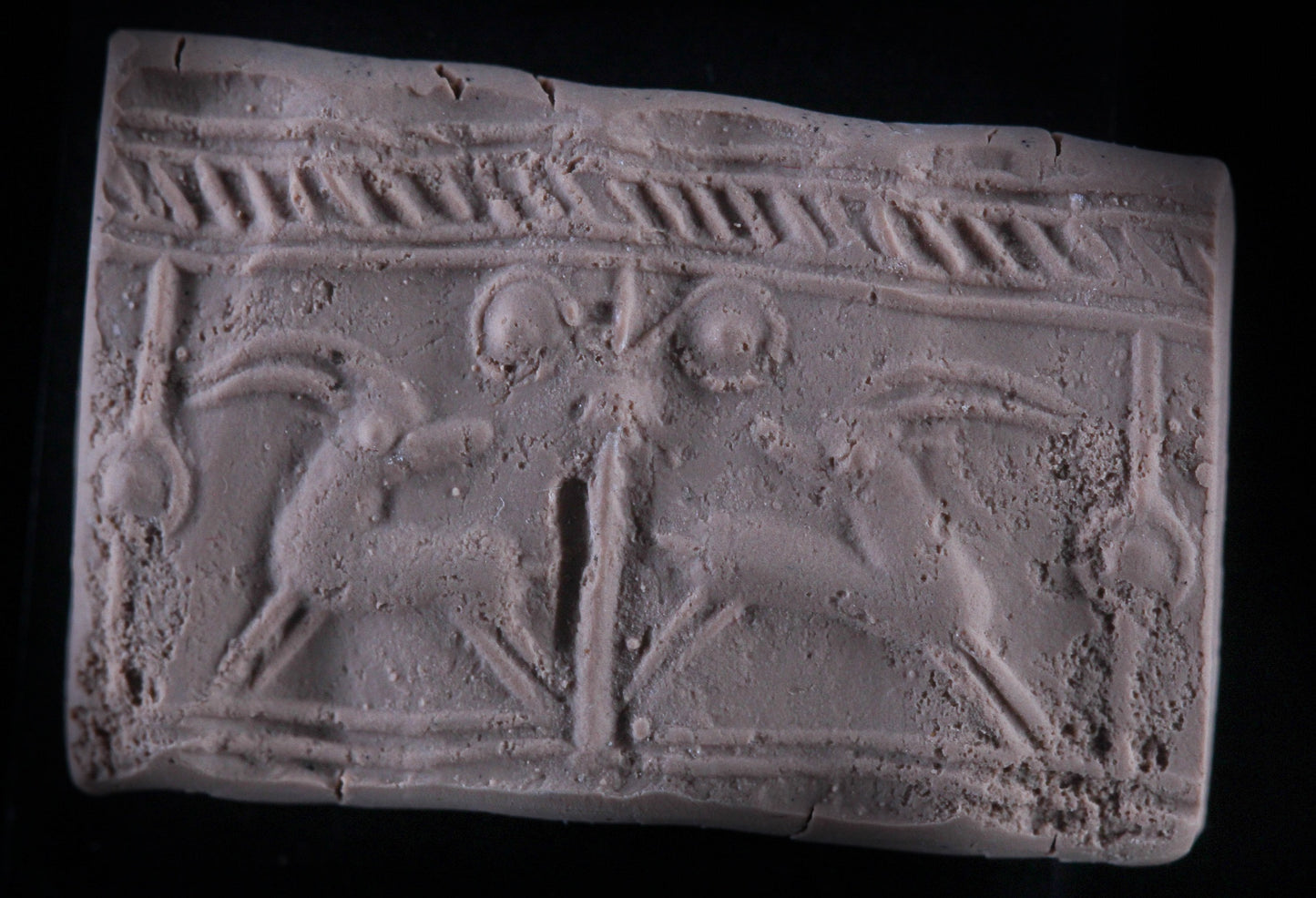 A FAIENCE CYLINDER SEAL
