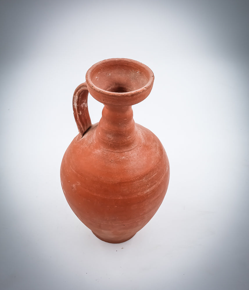 A NORTH-AFRICAN RED-SLIP TERRACOTTA DECANTER