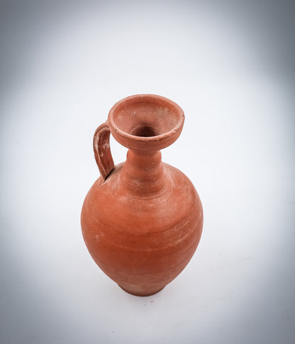 A NORTH-AFRICAN RED-SLIP TERRACOTTA DECANTER