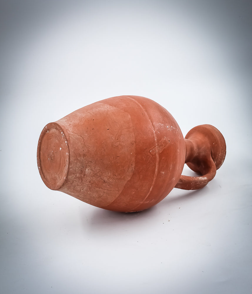 A NORTH-AFRICAN RED-SLIP TERRACOTTA DECANTER