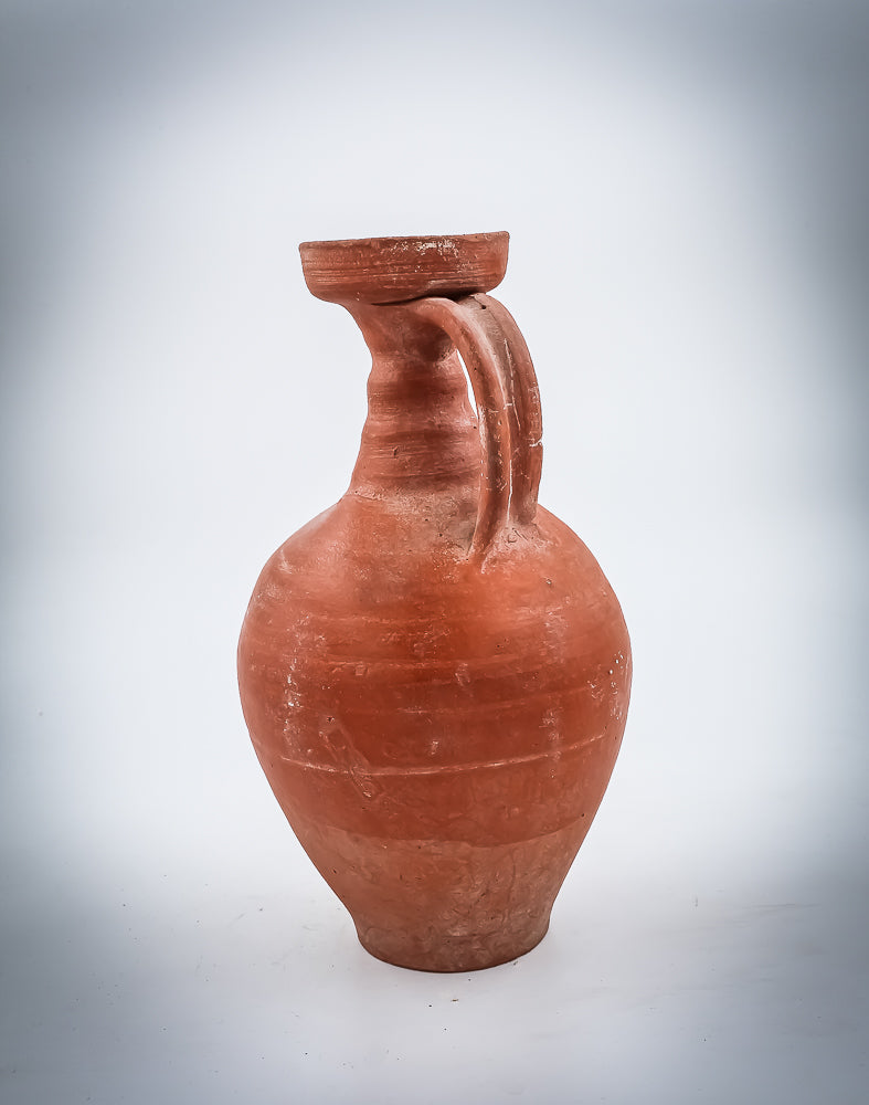 A NORTH-AFRICAN RED-SLIP TERRACOTTA DECANTER